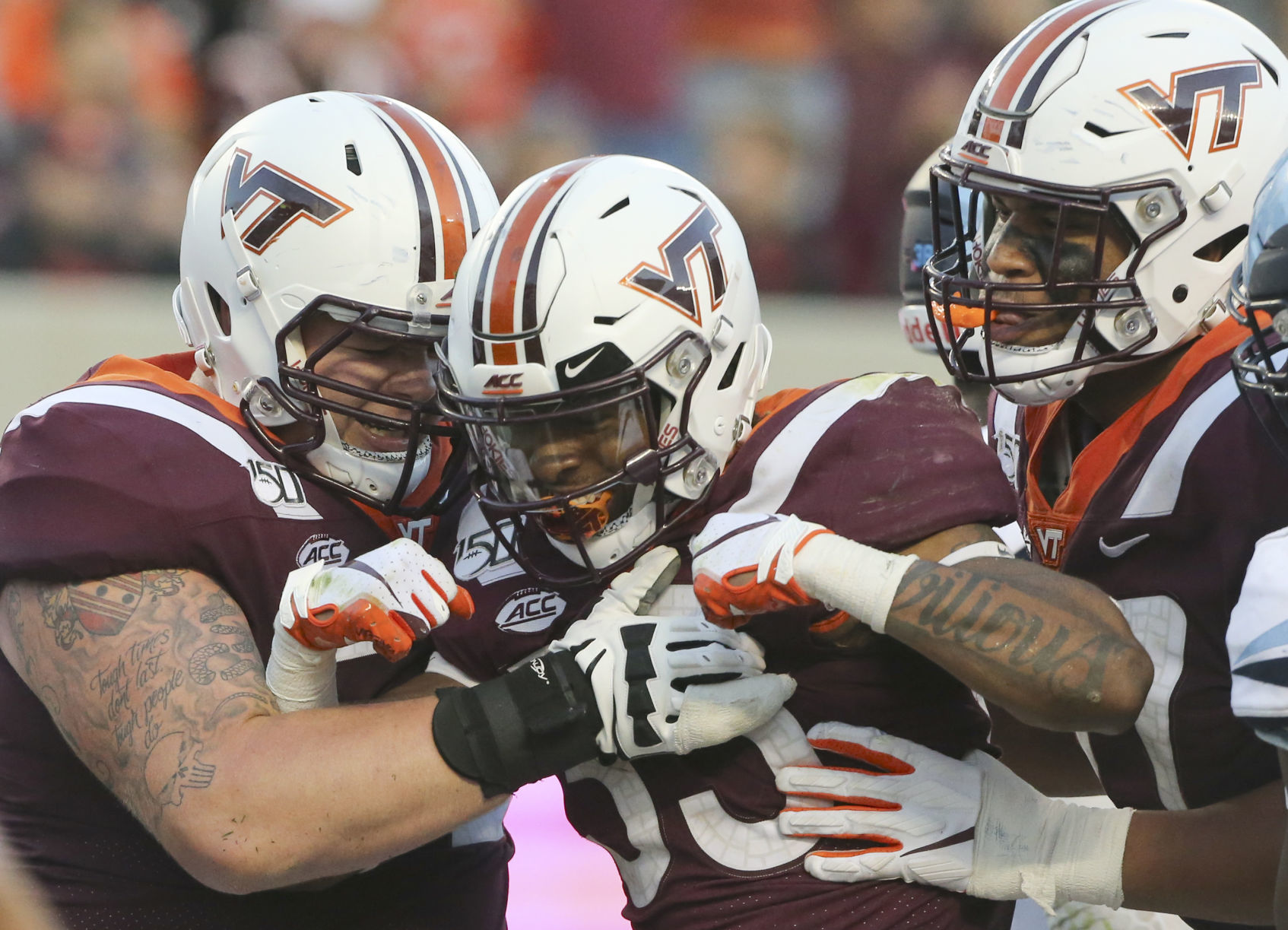 Austin Cannon, Deshawn McClease, and Christian Darrisaw